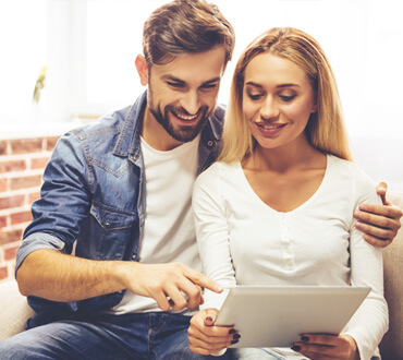 happy couple with gadget