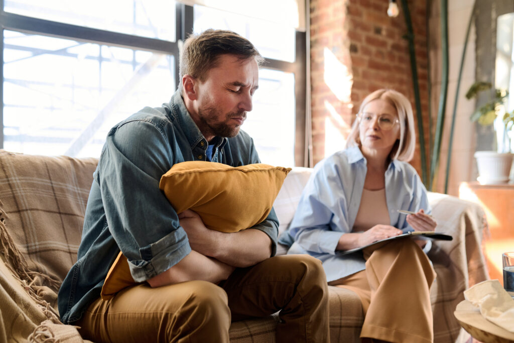 man in depression visiting psychologist